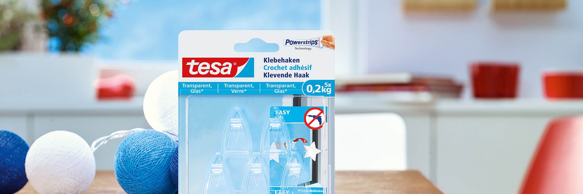 使用tesa®透明玻璃用无痕挂钩（0.2公斤）。