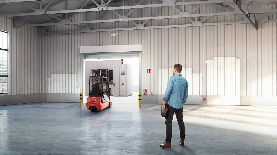 A small stack of products in boxes sitting on a manual pallet jack in a loading dock door at a distribution warehouse. A small stack of products in boxes sitting on a manual pallet jack in a loading dock door at a distribution warehouse.