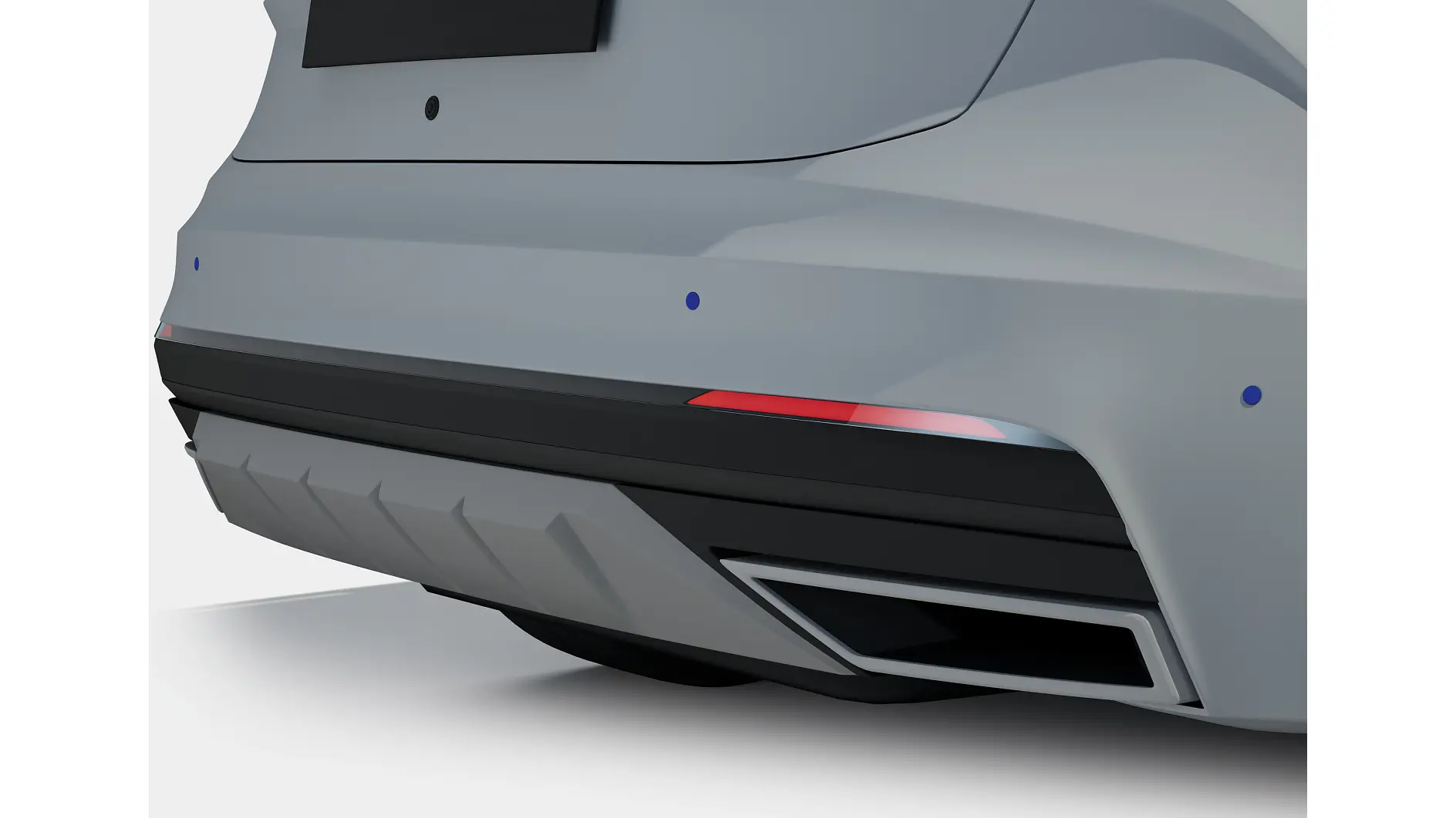 Rear bumper of a gray car with integrated black diffuser and red reflector, shown in a clean studio setting. (This text has been generated by AI)